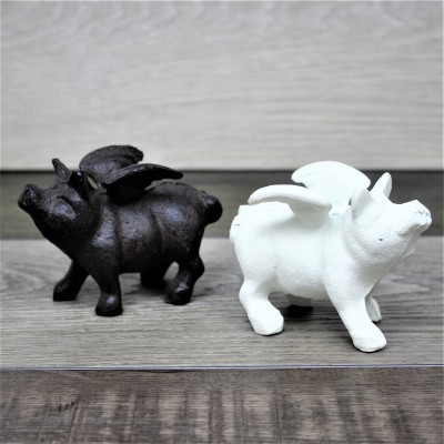 G049- CAST IRON WHITE FLYING PIG